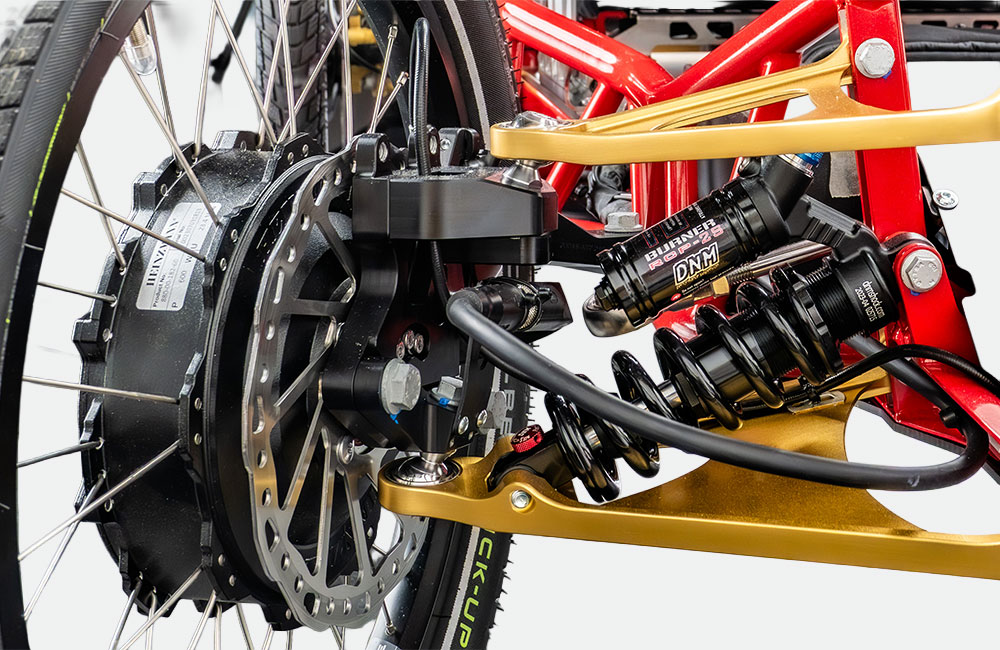 Technikdetail mit Scheibenbremse und Stoßdämpfer des Escalador Elektrorollstuhl Allrad